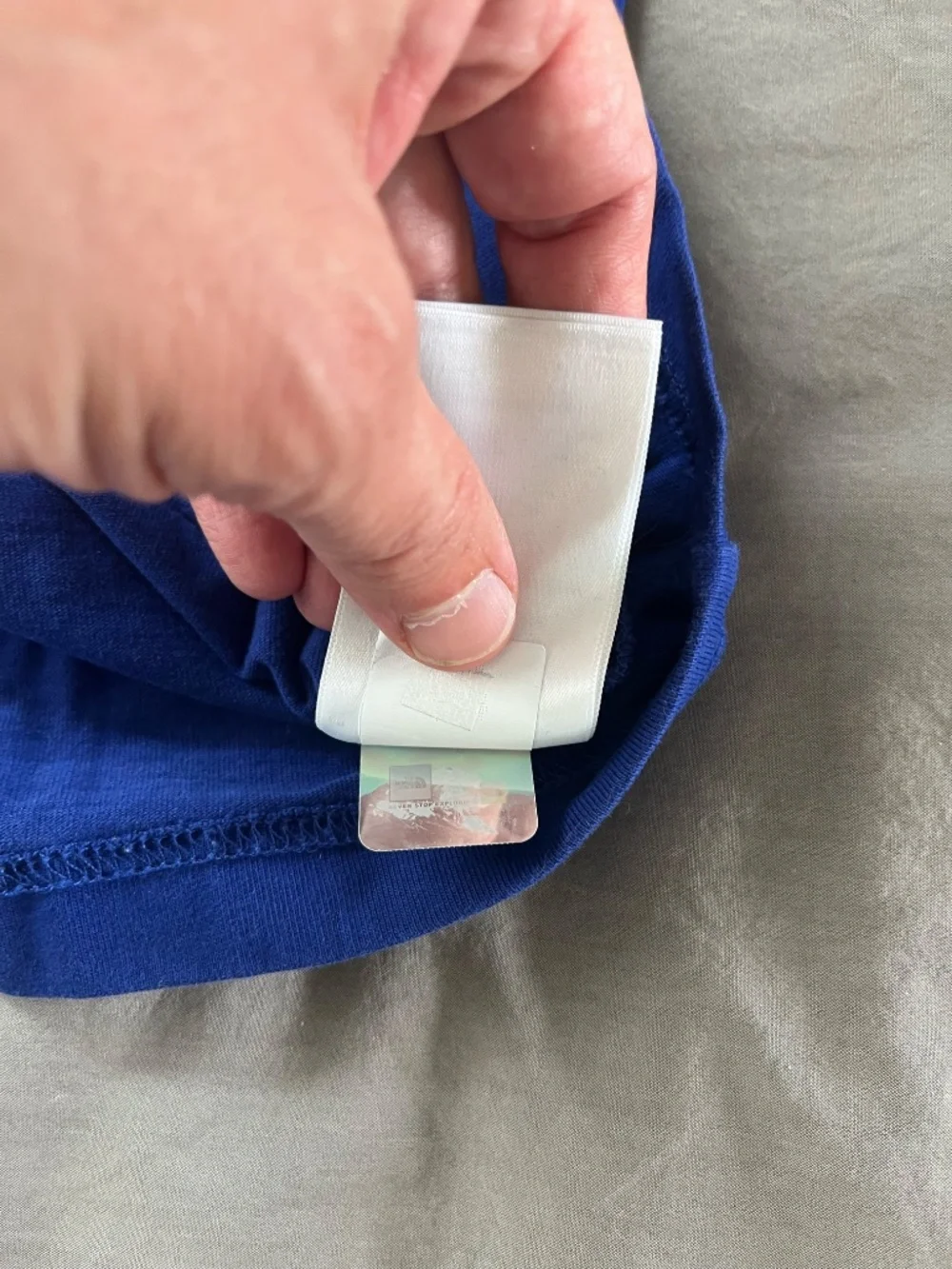 The North Face worn blue shirt